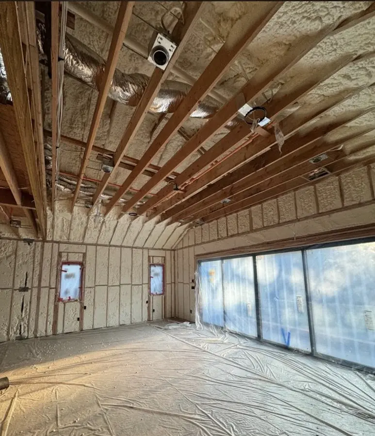 Interior walls and ceiling insulated with spray foam during new construction in Darien